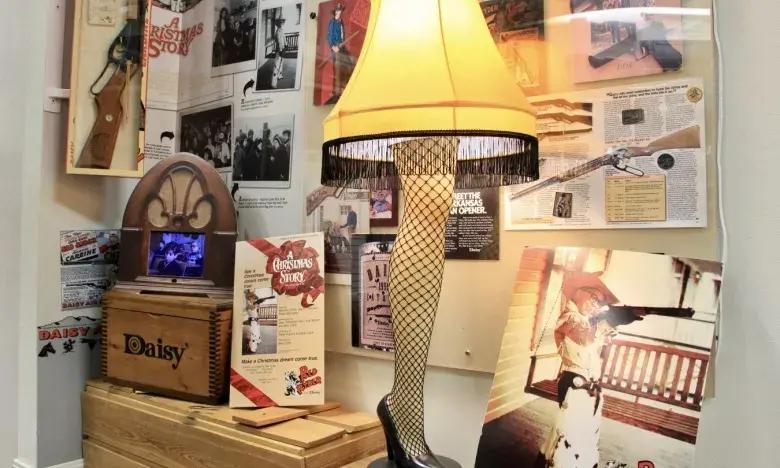 Quirky leg lamp with a yellow shade among vintage memorabilia.