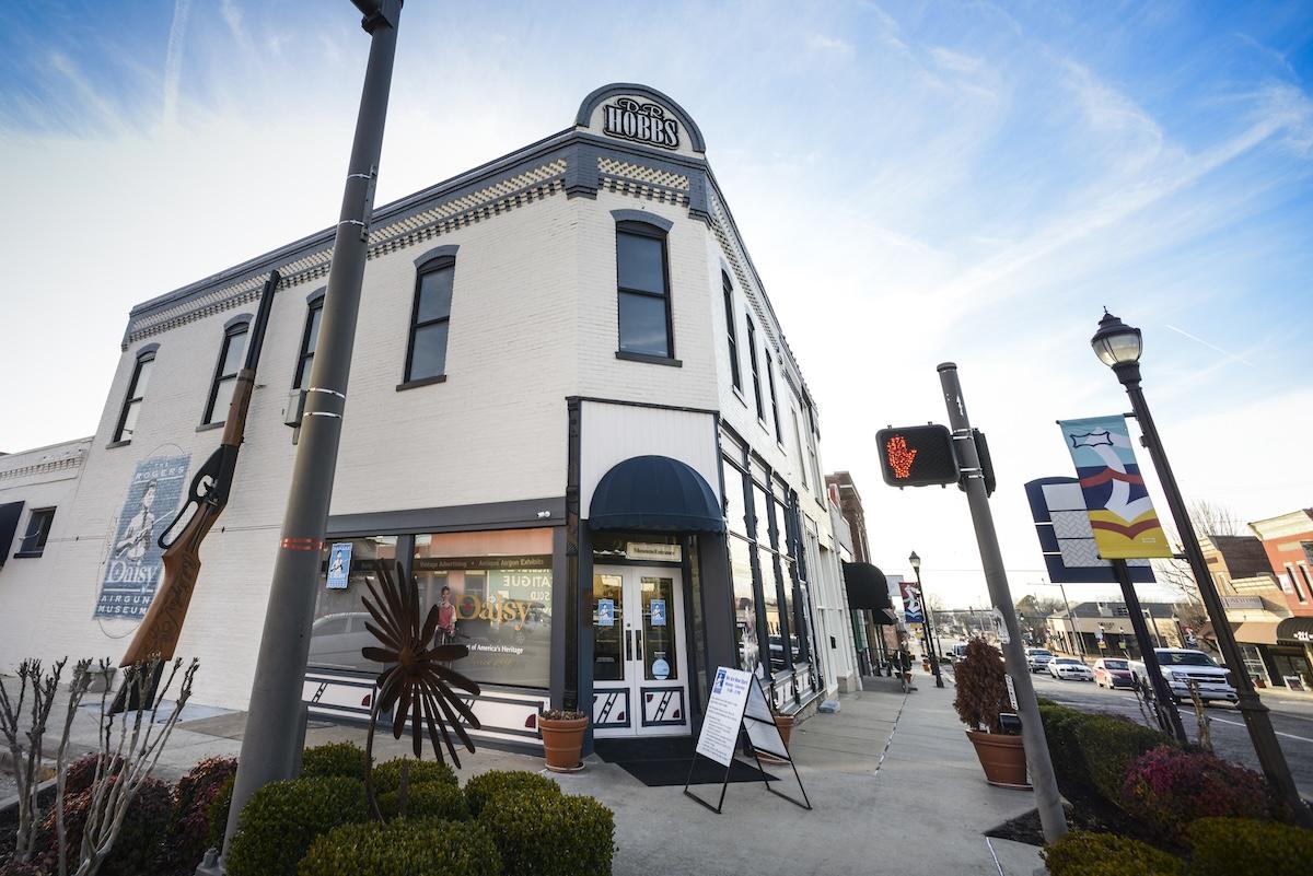 Historic corner building with blue sky background.