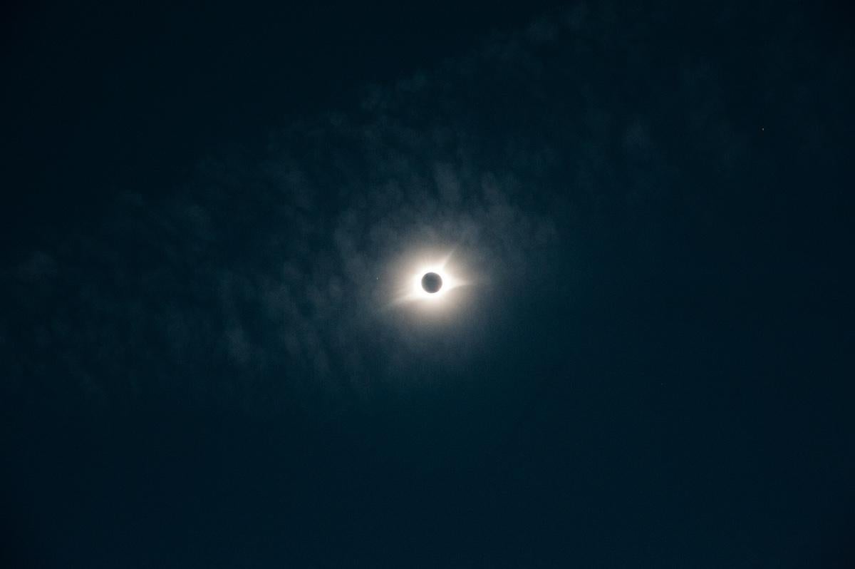 Total solar eclipse against a dark sky.