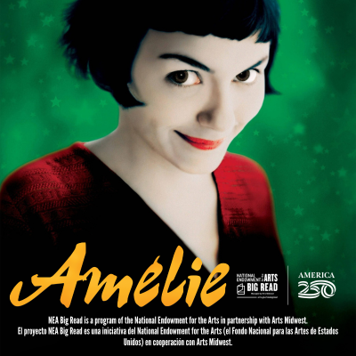 Smiling woman with short dark hair in red shirt, green background.