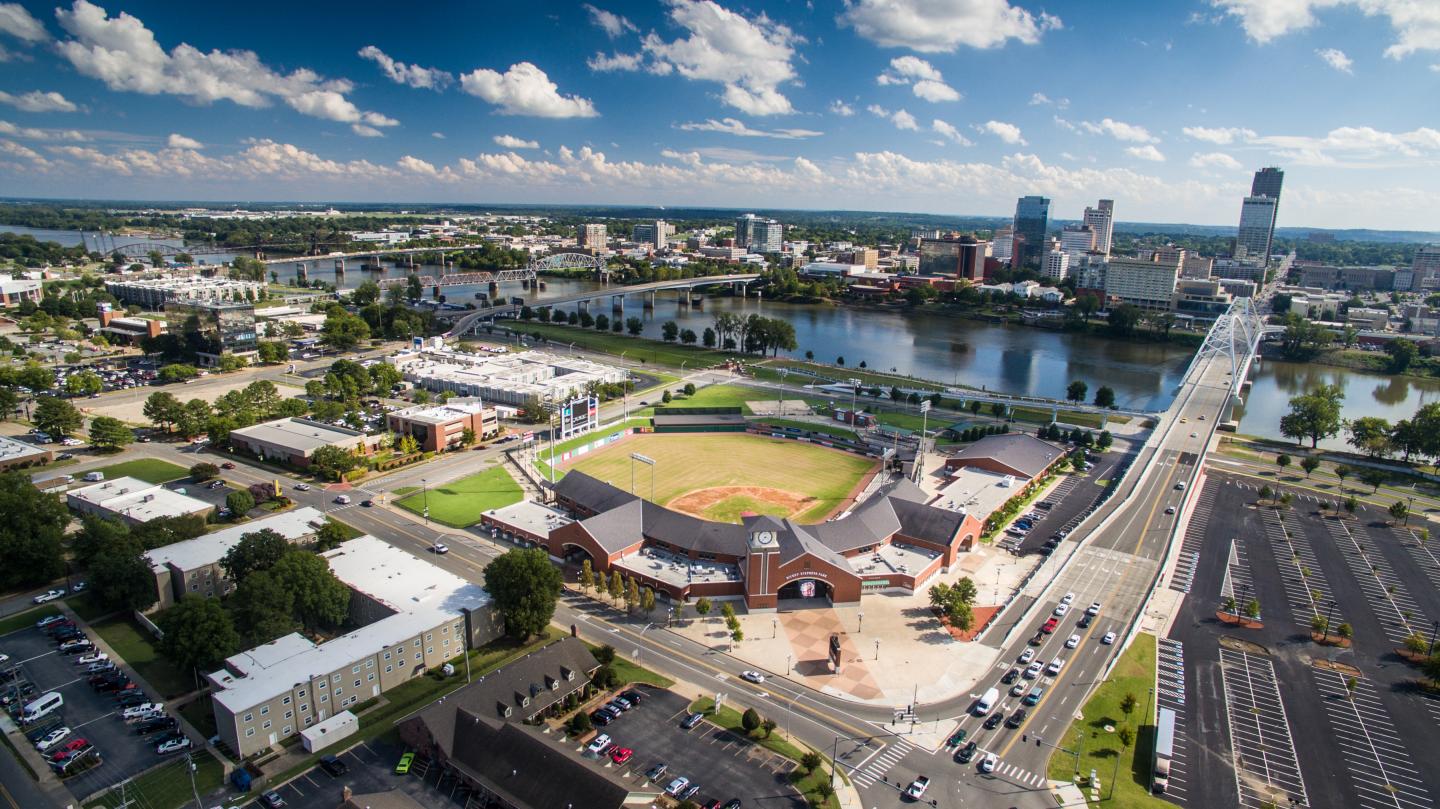 Aerial view of North Little Rock and Little Rock skylines with a Dickey Stephens stadium on the Arkansas River.
