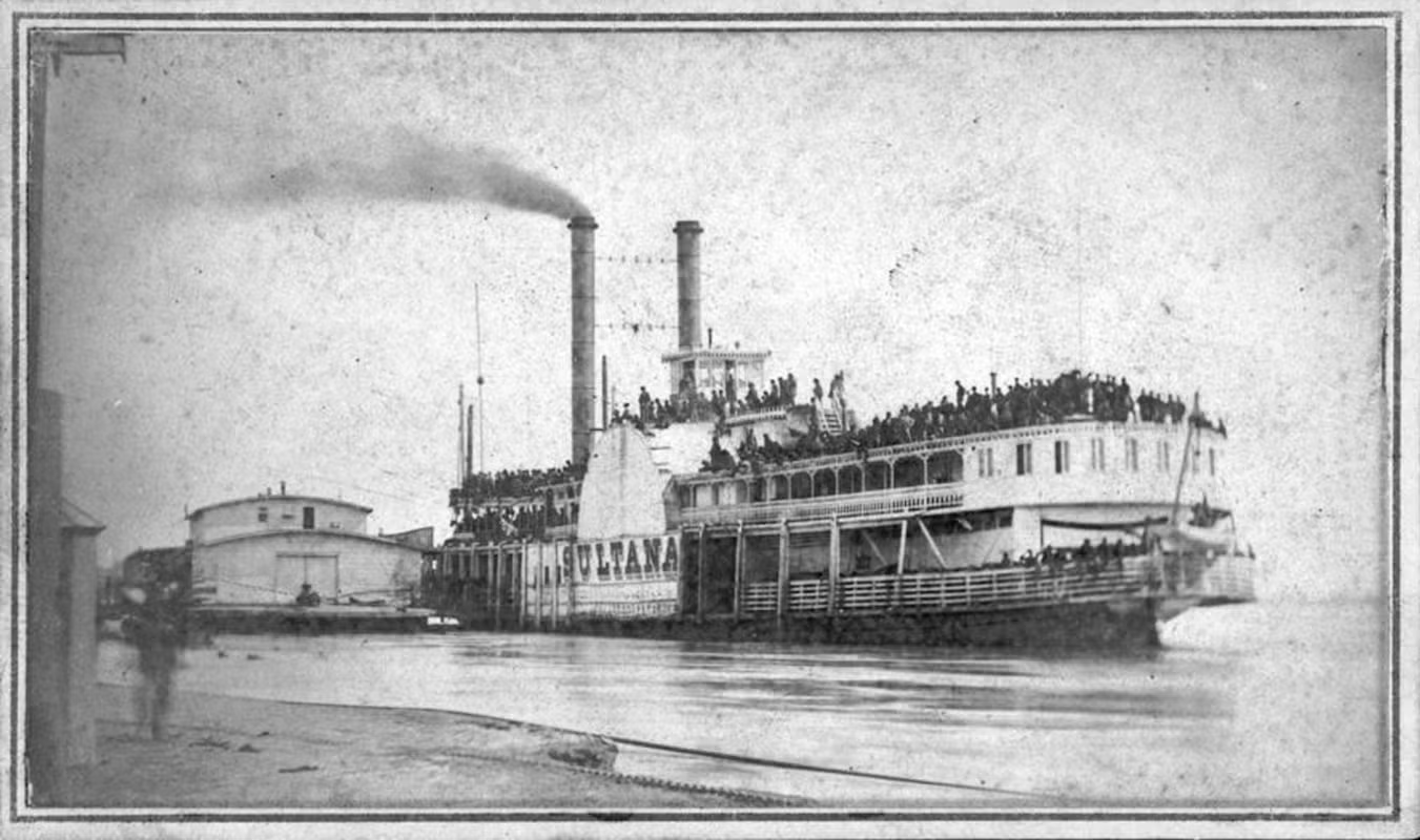 Steamboat on a river, with smoke rising from stacks, crowded with passengers.