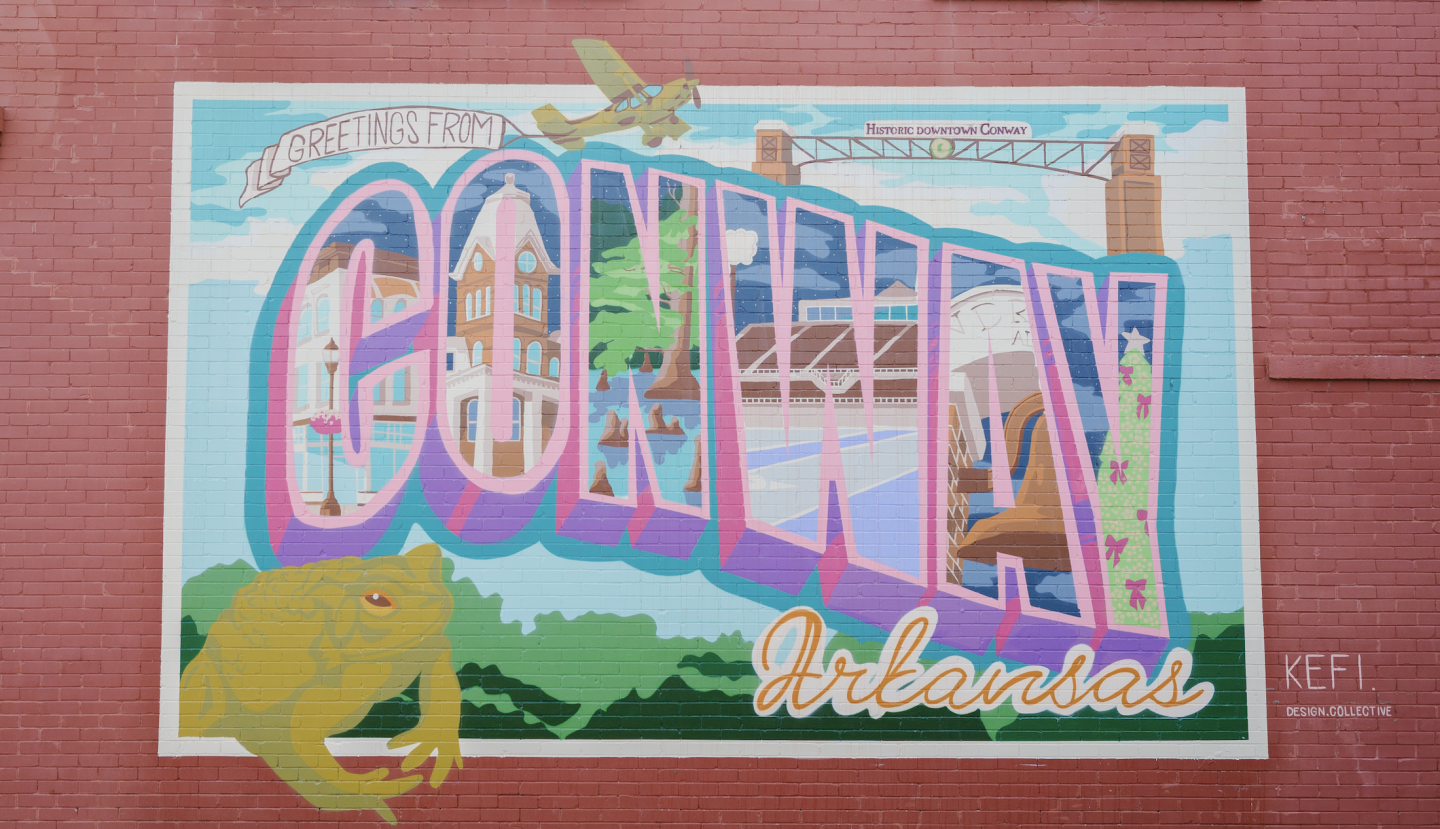 Conway, Arkansas colorful postcard-style mural with nature and landmarks.