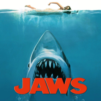 Swimmer above a large shark underwater with red text "JAWS".