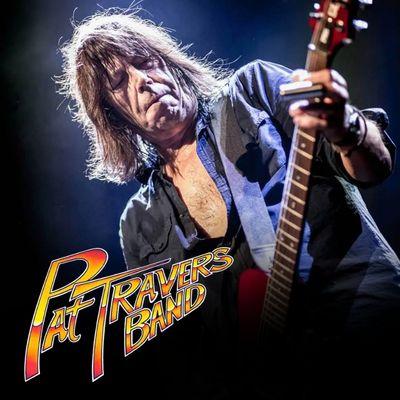 Musician playing guitar under stage lights, text "Pat Travers Band" in colorful font.