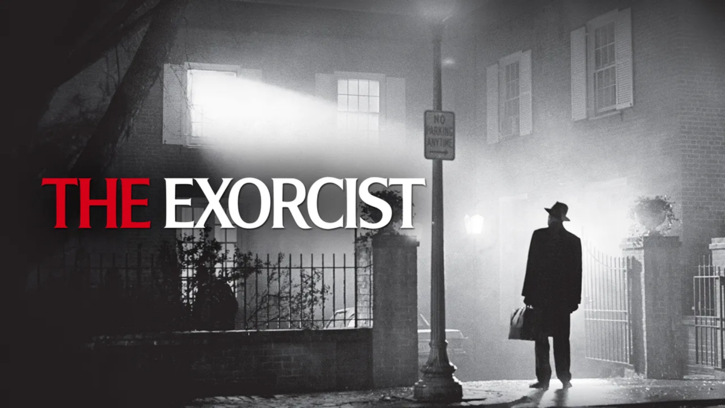 The Exorcist poster: silhouetted man under a streetlamp outside a foggy house.