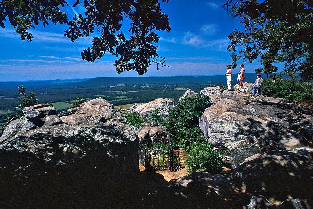 A family hiking at Petit Jean State Park