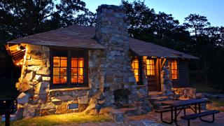 The exterior of a stone cabin at Mount Nebo State Park