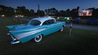 Antique cars take in a movie at the Kenda Drive Inn in Marshall