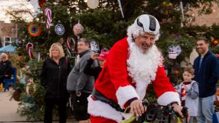 A Cycling Santa in downtown Springdale