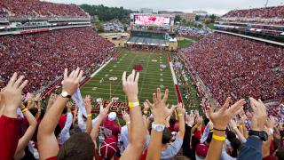 Fans cheer at a University of Arkansas football game in Fayetteville.