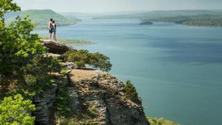 Two hikers at the overlook at Sugar Loaf Mountain
