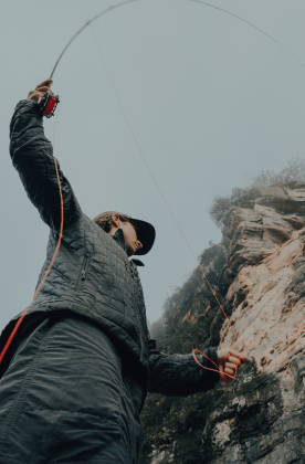woman fly fishing mid cast